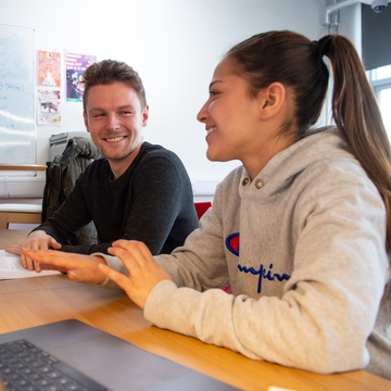 SOC students working in collaborative area of lab