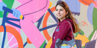 Student in front of colourful background