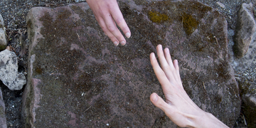 two hand reaching for each other
