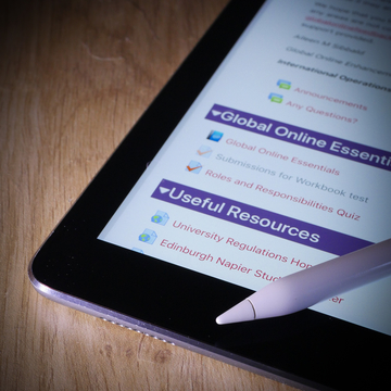 iPad and pen on a desk